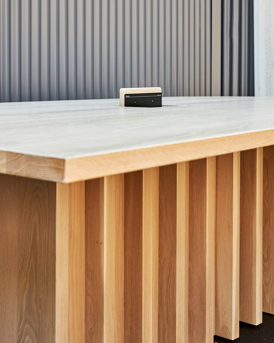 wooden conference table with concealed power